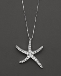 Gracefully undulating starfish pendant necklace with pave diamond clusters. Gracefully undulating starfish pendant necklace with pave diamond clusters.