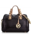Reach for this signature satchel from MICHAEL Michael Kors and delight in its diva-worthy design. Sumptuous patent leather is adorned with gleaming hardware, MK logo pattern and chain-link detailing, while the pocket-lined interior discretely stows your daily essentials.