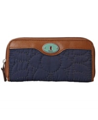 This zip clutch by Fossil features a classic shape and an easy-going boho feel. With a unique quilted exterior and silvertone trim, staying organized has never looked this good. This zip clutch by Fossil features a classic shape and an easy-going boho feel. With a unique quilted exterior and silvertone trim, staying organized has never looked this good.