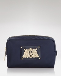 Simple and streamlined. This Juicy Couture cosmetics case is a fuss-free beauty, crafted of durable nylon. Simple and streamlined. This Juicy Couture cosmetics case is a fuss-free beauty, crafted of durable nylon.