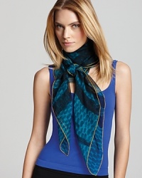 Bubbly, imperfect dots decorate a charming silk scarf from Burberry, pairing with the brand's signature check pattern and a primary hue. Bubbly, imperfect dots decorate a charming silk scarf from Burberry, pairing with the brand's signature check pattern and a primary hue.