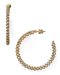 A jewel box staple gets an edgy glam update. This pair of ABS by Allen Schwartz hoop earrings is plated in gold and wrapped in rhinestone spikes. A jewel box staple gets an edgy glam update. This pair of ABS by Allen Schwartz hoop earrings is plated in gold and wrapped in rhinestone spikes.