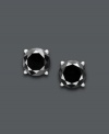 Dynamic diamond earrings that make a statement. Round-cut black diamonds (1-1/2 ct. t.w.) create a stunning silhouette against a 14k white gold post setting. Approximate diameter: 1/6 inch.