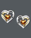 Sweet romance. Petite stud earrings feature heart-shaped citrine (7/8 ct. t.w.) and a diamond accent for extra sparkle. Set in 14k gold and sterling silver. Approximate diameter: 1/2 inch.