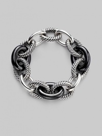 Bold oval links of black ceramic alternate with smooth and cabled sterling silver links in this striking bracelet. Black ceramic Sterling silver Length, about 8 Hidden spring clip clasp Imported Bold oval links of black ceramic alternate with smooth and cabled sterling silver links in this striking bracelet. Black ceramic Sterling silver Length, about 8 Hidden spring clip clasp Imported