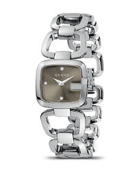 Feminine styling from the G-Gucci collection. Stainless G bezel casing frames a brown sun-brushed dial with 3 diamond hour indices. Stainless bracelet link strap with jewelry clasp. Feminine styling from the G-Gucci collection. Stainless G bezel casing frames a brown sun-brushed dial with 3 diamond hour indices. Stainless bracelet link strap with jewelry clasp.