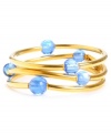 Add a sweet pop of color in threes. Kenneth Cole New York's three bangle set features shimmery blue glass beads and a gold-plated mixed metal setting. Bracelets stretch to fit wrist. Approximate diameter: 2-1/2 inches.