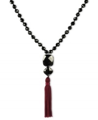 Dramatically chic. This pretty v-shaped necklace highlights black onyx beads (198 ct. t.w.) and a trendy tassel accent in burgundy. Set in sterling silver. Approximate length: 28 inches. Approximate drop: 4-1/2 inches. Dramatically chic. This pretty v-shaped necklace highlights black onyx beads (198 ct. t.w.) and a trendy tassel accent in burgundy. Set in sterling silver. Approximate length: 28 inches. Approximate drop: 4-1/2 inches.