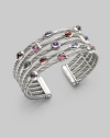 From the Confetti Collection. Five twisted sterling silver cables, scattered with a colorful array of faceted gemstones, in a fabulous open cuff design. Garnet, iolite, rhodalite garnet, pink tourmaline and amethyst Sterling silver Diameter, about 2½ Width, about 1 Imported