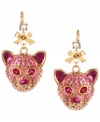 Jungle cat chic. Glitzy tiger charms and a dainty bow adorn these charming drop earrings from Betsey Johnson. Embellished with pink-colored crystals, they're crafted in antique gold tone mixed metal. Crystal accents at post. Approximate drop: 2-1/4 inches.