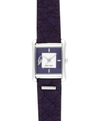 Exotic textures and bold color combine for the perfect everyday watch, by Nine West. Crafted of purple textured leather strap and square silver tone mixed metal case. Purple dial with white inner dial features silver tone applied stick indices, numeral at nine o'clock, silver tone hour and minute hands, sweeping second hand and logo at six o'clock. Quartz movement. Limited lifetime warranty. Exotic textures and bold color combine for the perfect everyday watch, by Nine West. Crafted of purple textured leather strap and square silver tone mixed metal case. Purple dial with white inner dial features silver tone applied stick indices, numeral at nine o'clock, silver tone hour and minute hands, sweeping second hand and logo at six o'clock. Quartz movement. Limited lifetime warranty.