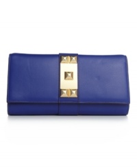 Bold, graphic, and striking, this Clutch from Vince Camuto is a wholly chic essential. The boxy rectangular shape in soft leather pairs perfectly with the geometric metal ornament on the flap front. Bold, graphic, and striking, this Clutch from Vince Camuto is a wholly chic essential. The boxy rectangular shape in soft leather pairs perfectly with the geometric metal ornament on the flap front.