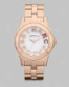 Colorful crystals accent the logo dial on this simply chic, stainless steel style. Quartz movementWater resistant to 5 ATMRound rose goldtone ion-plated stainless steel case, 40mm (1.6) Smooth bezelWhite dialCrystal accented and smooth logo hour markersSecond hand Rose goldtone ion-plated stainless steel link braceletImported 