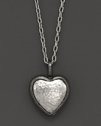 A hammered sterling silver heart makes a romantic, modern statement. A hammered sterling silver heart makes a romantic, modern statement.