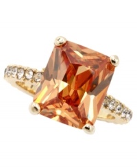 Feel like royalty every time you wear this luscious, caramel-colored ring. Design by City by City features an emerald-cut cubic zirconia (7-1/2 ct. t.w.) with sparkling accents at the shoulders. Crafted in gold tone mixed metal. Sizes 7 and 8. Feel like royalty every time you wear this luscious, caramel-colored ring. Design by City by City features an emerald-cut cubic zirconia (7-1/2 ct. t.w.) with sparkling accents at the shoulders. Crafted in gold tone mixed metal. Sizes 7 and 8.