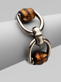 From the Bamboo Silver Collection. A stand-out piece with a sterling silver horsebit motif with a shiny, aged palladium finish and bamboo accents. Palladium-finished sterling silverBambooHinged clasp closureLength, about 6¼Made in Italy From the Bamboo Silver Collection. A stand-out piece with a sterling silver horsebit motif with a shiny, aged palladium finish and bamboo accents. Palladium-finished sterling silverBambooHinged clasp closureLength, about 6¼Made in Italy