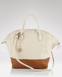 Join the color block bag party with this two-tone leather satchel from DKNY. In a roomy shape, it's proof that trend-right accessorizing can be positively practical. Join the color block bag party with this two-tone leather satchel from DKNY. In a roomy shape, it's proof that trend-right accessorizing can be positively practical.