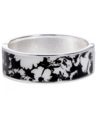 Channel the exoticism and energy of Brasil in Haskell's inspired skinny bangle. The Floral bangle features a black and white flower design, set in silver tone mixed metal with a hinge clasp. Approximate diameter: 2-1/2 inches. Approximate length: 8 inches. Item comes packaged in a turquoise gift box.