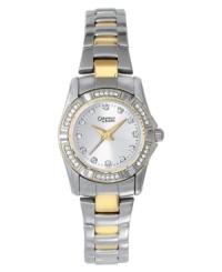 Elevate your style with this feminine and eye-catching timepiece from Caravelle by Bulova. Silvertone mixed metal bracelet with goldtone accents. Mixed metal case and sparkling crystal bezel. Silvertone dial with logo, crystal markers and goldtone hands. Quartz movement. Water resistant to 30 meters. Three-year limited warranty. Elevate your style with this feminine and eye-catching timepiece from Caravelle by Bulova. Silvertone mixed metal bracelet with goldtone accents. Mixed metal case and sparkling crystal bezel. Silvertone dial with logo, crystal markers and goldtone hands. Quartz movement. Water resistant to 30 meters. Three-year limited warranty.