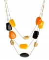 Fashion with nothing to hide. Kenneth Cole New York's colorful illusion necklace boasts geometrical beads in brown, yellow, orange and gold tone mixed metal. Three-row setting crafted from gold tone mixed metal. Approximate length: 16 inches + 3-inch extender. Approximate drop: 2-3/4 inches.