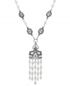 A tassel that's well worth it. Genevieve & Grace's sterling silver pendant features cultured freshwater pearls (4-4-1/2 mm) in a prominent fashion, as well as marcasite to enhance the appeal. Approximate length: 18 inches. Approximate drop: 1-3/4 inches. Approximate drop width: 1-1/8 inches.
