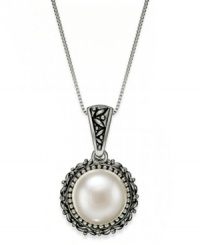 Dedicated to elegance. This beautiful cultured freshwater pearl necklace (11-1/2-12mm) sits in an intricately-engraved sterling silver setting. Approximate length: 19 inches. Approximate drop: 1 inch. Dedicated to elegance. This beautiful cultured freshwater pearl necklace (11-1/2-12mm) sits in an intricately-engraved sterling silver setting. Approximate length: 19 inches. Approximate drop: 1 inch.