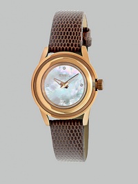 From the Orchestra Collection. A luxurious timepiece in warm rose goldtone ion-plated stainless steel with a dazzling Swarovski crystal markers. Quartz movementWater resistant to 10 ATMRound rose goldtone ion-plated stainless steelcase, 28mm (1.1) Multi-layer bezelMother-of-pearl dialFour Swarovski crystal markersBrown lizard strapImported