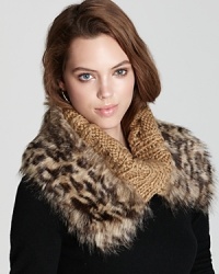 A luxurious look from MICHAEL Michael Kors, this fold-over neckwarmer is accented with faux cheetah fur and logo buttons. A luxurious look from MICHAEL Michael Kors, this fold-over neckwarmer is accented with faux cheetah fur and logo buttons.