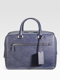 Sleek and sophisticated in textured saffiano leather with a double-zip closure. Leather handles Leather luggage tag Exterior zip pocket Interior zip pocket Fully lined 15¾W X 11H X 7D Made in Italy