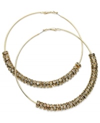 GUESS proves to be well-rounded with this pair of clutchless hoop earrings. Crafted from gold-tone mixed metal, the earrings feature gold-tone and glass crystal discs for a stunning effect. Approximate diameter: 2-1/2 inches. GUESS proves to be well-rounded with this pair of clutchless hoop earrings. Crafted from gold-tone mixed metal, the earrings feature gold-tone and glass crystal discs for a stunning effect. Approximate diameter: 2-1/2 inches.