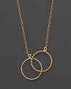 Dazzling interlocking circles of 14K yellow gold.