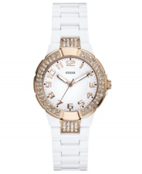 Rosy hues burst from a refined background on this shimmering timepiece from GUESS. Rosy hues burst from a refined background on this shimmering timepiece from GUESS.