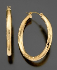 A touch of shine, a swirl of engraving, these beautiful 14k gold hoop earrings have all the right elements. Approximate diameter: 1 inch. A touch of shine, a swirl of engraving, these beautiful 14k gold hoop earrings have all the right elements. Approximate diameter: 1 inch.
