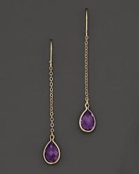 A graceful single drop earring rendered with blushing amethyst on yellow gold. A graceful single drop earring rendered with blushing amethyst on yellow gold.