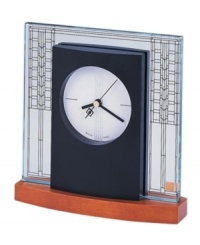 Adapted from the art glass window in the living room of the W. A. Glasner House in Glencoe, Illinois, circa 1905, this desk clock from the Frank Lloyd Wright collection is a contemporary conversation piece. Etched glass and round dial featuring three hands is set in a solid wood base with light cherry stain. Adapted from the art glass window in the living room of the W. A. Glasner House in Glencoe, Illinois, circa 1905, this desk clock from the Frank Lloyd Wright collection is a contemporary conversation piece. Etched glass and round dial featuring three hands is set in a solid wood base with light cherry stain.