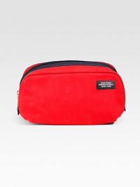 Refined shape of durable coated canvas in a searing crimson shade. Zip-around closureCoated canvas lining4W X 8H X 4DImported Refined shape of durable coated canvas in a searing crimson shade. Zip-around closureCoated canvas lining4W X 8H X 4DImported