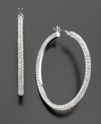 Sparkling style by Lauren Ralph Lauren: these lovely crystal & glass pave hoop earrings are the perfect finishing touch for your evening look. Approximate diameter: 1-1/2 inches.