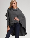 Beautifully draped merino/angora knit with elegant ruffle trim. About 42 X 54 Merino/angora; dry clean Made in Scotland