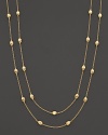 From the Siviglia Collection, the gold necklace with small station gold beads, designed by Marco Bicego. Can be worn doubled or as one long strand.