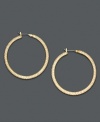 Lauren by Ralph Lauren adds sparkle to classic hoop earrings by turning them inside out and adding a layer of pave crystal. Crafted in goldtone mixed metal. Approximate diameter: 1-1/2 inches.