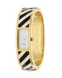 Just the ticket. This kate spade new york bangle watch takes its cues from the jewel box, crafted of plated metal and styled to bring a dose of whimsical allure to your timekeeping. Just the ticket. This kate spade new york bangle watch takes its cues from the jewel box, crafted of plated metal and styled to bring a dose of whimsical allure to your timekeeping.