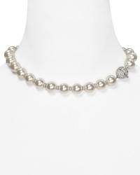 A strand of shimmering simulated pearls takes on a new state of grace on this Nadri necklace, set in silver tone plate and bedecked with pave-adorned stations. A strand of shimmering simulated pearls takes on a new state of grace on this Nadri necklace, set in silver tone plate and bedecked with pave-adorned stations.