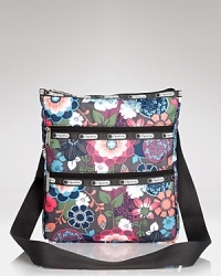 LeSportsac's signature crossbody is updated in a floral-printed nylon. This cooly functional bag features exterior pockets and an adjustable strap for effortless on-the-go style. LeSportsac's signature crossbody is updated in a floral-printed nylon. This cooly functional bag features exterior pockets and an adjustable strap for effortless on-the-go style.
