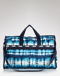 Are you ready for the weekend? LeSportsac's nylon duffel in a playful dip-dye print is a practical pack-up choice for three day getaways. Are you ready for the weekend? LeSportsac's nylon duffel in a playful dip-dye print is a practical pack-up choice for three day getaways.