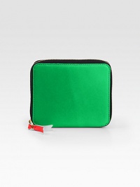 This compact leather style with a contrast tassel and multicolored inside panels adds a pop of color to your look.Zip closureOne inside snap pocketOne bill slotFour credit card slotsLeather lining4W X 5H X 1DImported This compact leather style with a contrast tassel and multicolored inside panels adds a pop of color to your look.Zip closureOne inside snap pocketOne bill slotFour credit card slotsLeather lining4W X 5H X 1DImported
