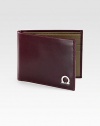 Remarkably smooth calfskin leather lends a distinguished tone to a classic wallet, accented with signature gancini ornament.Two billfold compartmentsSix card slotsLeather4W x 3HMade in Italy