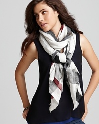 In the brand's signature palette, this crinkled, check printed scarf from Burberry lends lightweight luxe. In the brand's signature palette, this crinkled, check printed scarf from Burberry lends lightweight luxe.