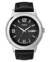 Timex updates a classic dress watch with the addition of contemporary details. Black leather strap and round silver tone mixed metal case. Black dial with inner grid-patterned dial features silver tone numerals at twelve, six and nine o'clock, stick indices, day and date window at three o'clock, luminous hands, and logo. Quartz movement. Water resistant to 30 meters. One-year limited warranty. Timex updates a classic dress watch with the addition of contemporary details. Black leather strap and round silver tone mixed metal case. Black dial with inner grid-patterned dial features silver tone numerals at twelve, six and nine o'clock, stick indices, day and date window at three o'clock, luminous hands, and logo. Quartz movement. Water resistant to 30 meters. One-year limited warranty.