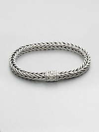 Small sterling silver bracelet in a squared, rope-weave pattern resembling herringbone, with push-lock closure.Sterling silverAbout 3 diam.Imported Small sterling silver bracelet in a squared, rope-weave pattern resembling herringbone, with push-lock closure.Sterling silverAbout 3 diam.Imported