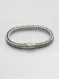 Small sterling silver bracelet in a squared, rope-weave pattern resembling herringbone, with push-lock closure.Sterling silverAbout 3 diam.Imported